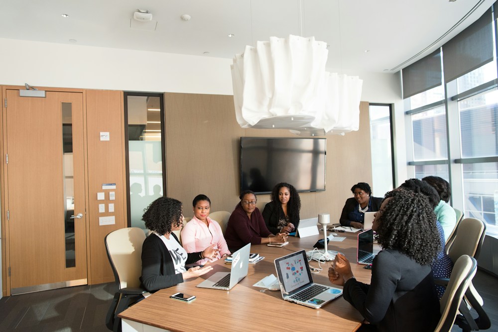 Business leaders discussing a project in a modern meeting room