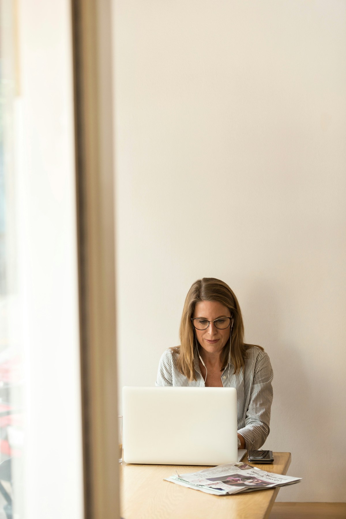 A professional working at a laptop